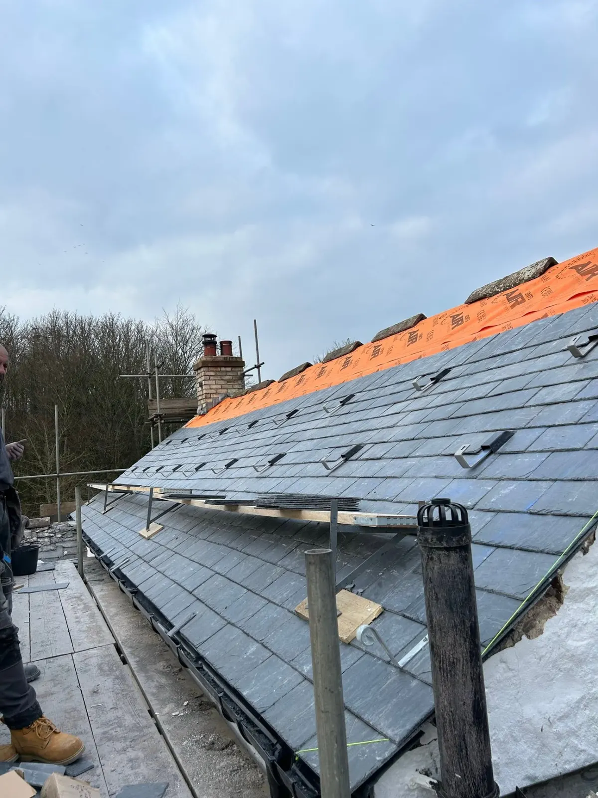 Slates being laid on a roof